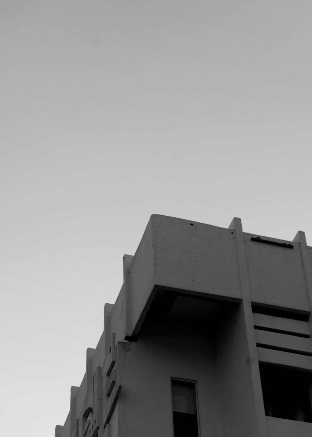 a black and white photo of a tall building