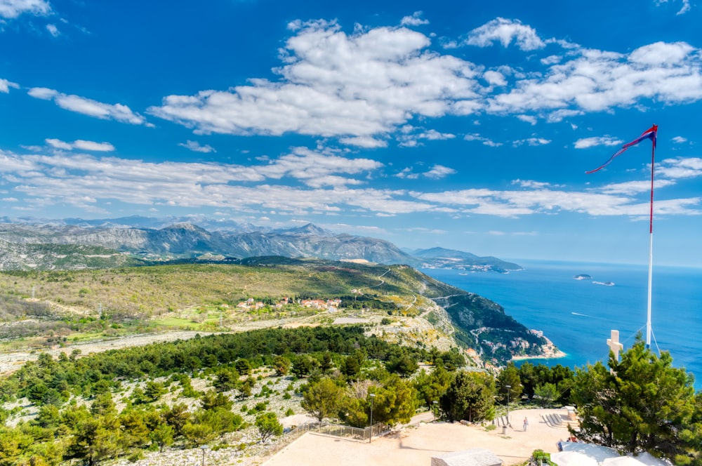 a view of the ocean from the top of a hill