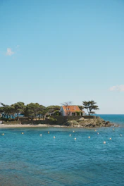 A calm seaside home symbolizing stability and fixed mortgage rates.