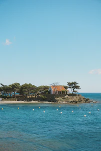 A calm seaside home symbolizing stability and fixed mortgage rates.