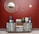 A rustic wooden sideboard with an eclectic design stands against a deep red wall. Above it, three decorative round mirrors with woven frames add an artistic touch. The sideboard is adorned with two tall blue speakers, a potted green plant, a picture frame, and a colorful 'HOME' sign. The floor is tiled in a neutral beige color, complementing the decor.