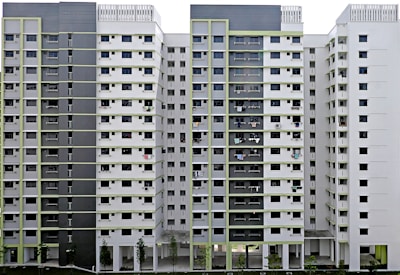 a tall building with lots of windows and balconies