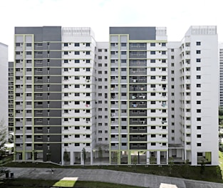 A modern multi-family building symbolizing steady rental income.