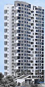 A sleek modern residential building surrounded by greenery under a clear sky.