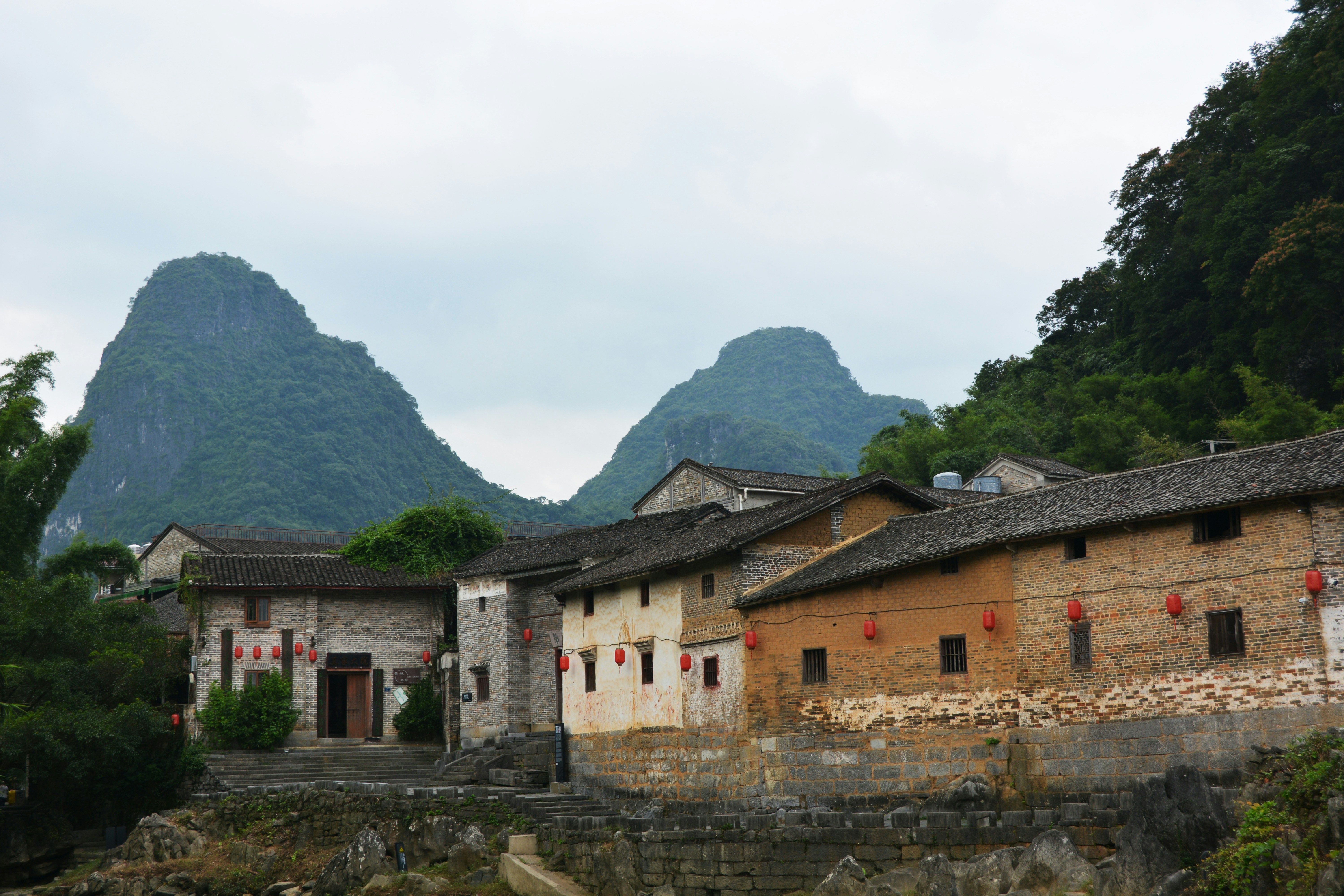 a village with mountains in the background