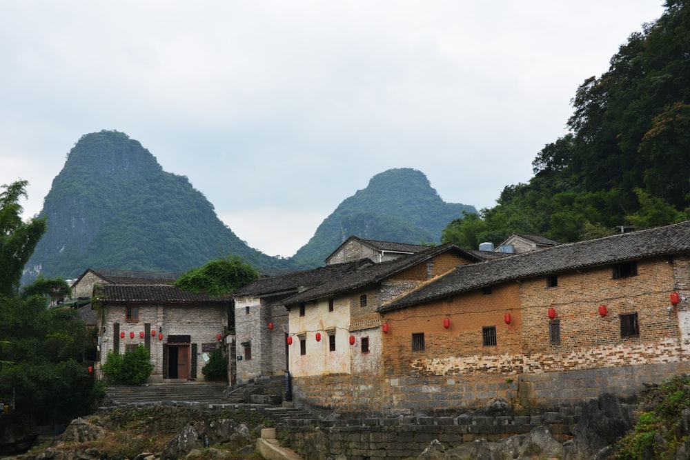 a village with mountains in the background