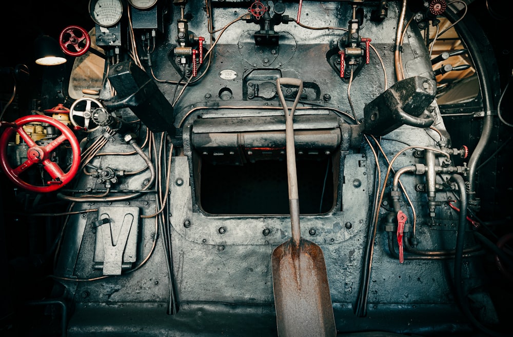 the inside of a large metal machine with many wires and gauges