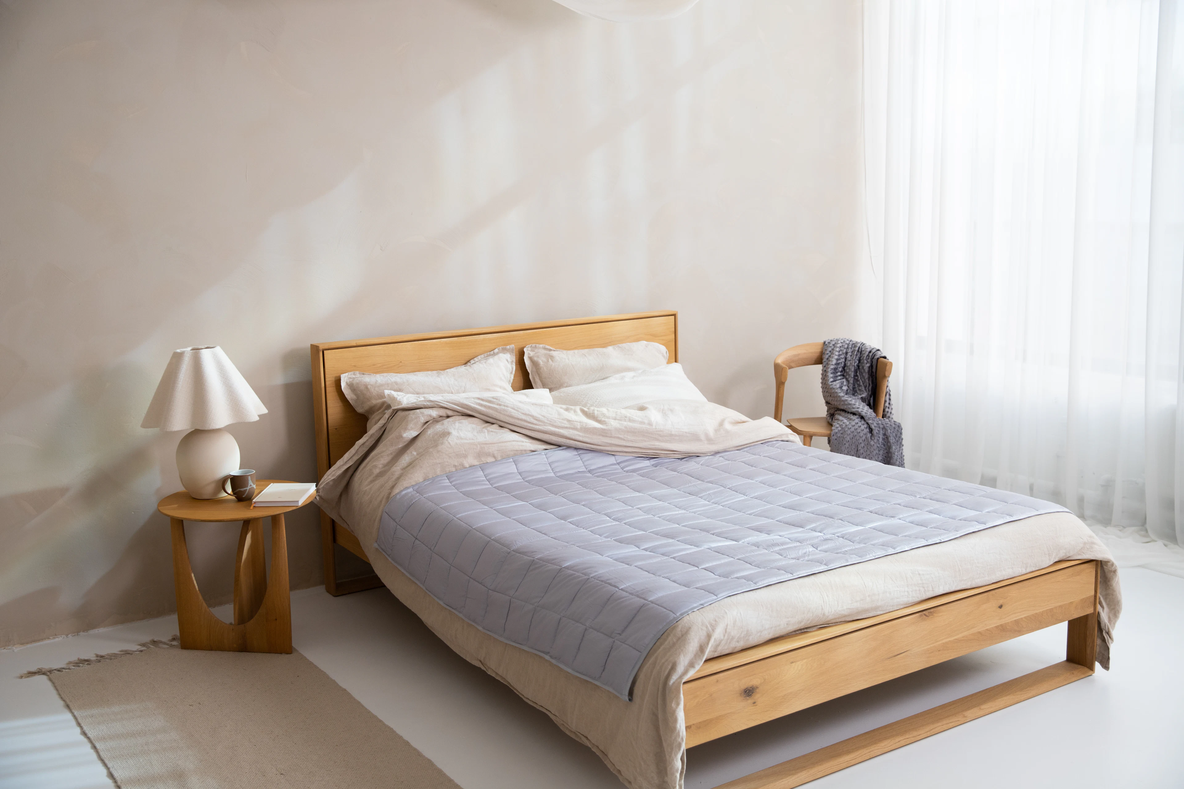 Light bamboo quilt on a timber bed