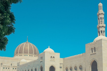 a large white building with a clock on it's side