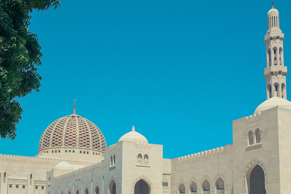 a large white building with a clock on it's side