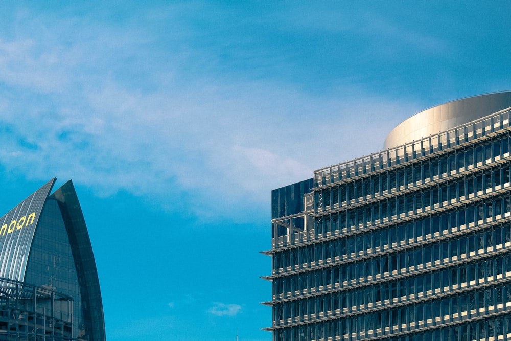 a very tall building sitting next to a very tall building