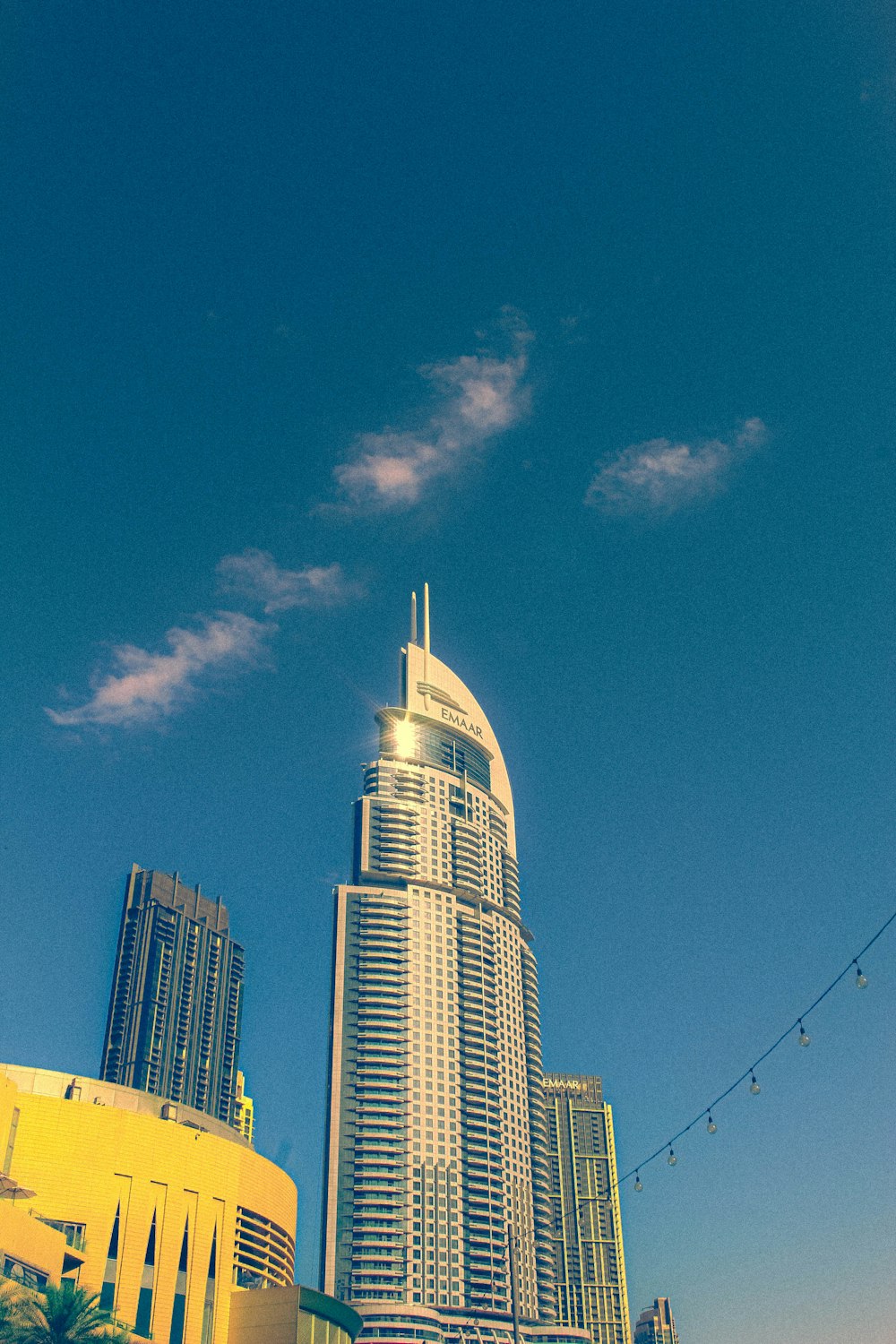 a tall building sitting in the middle of a city