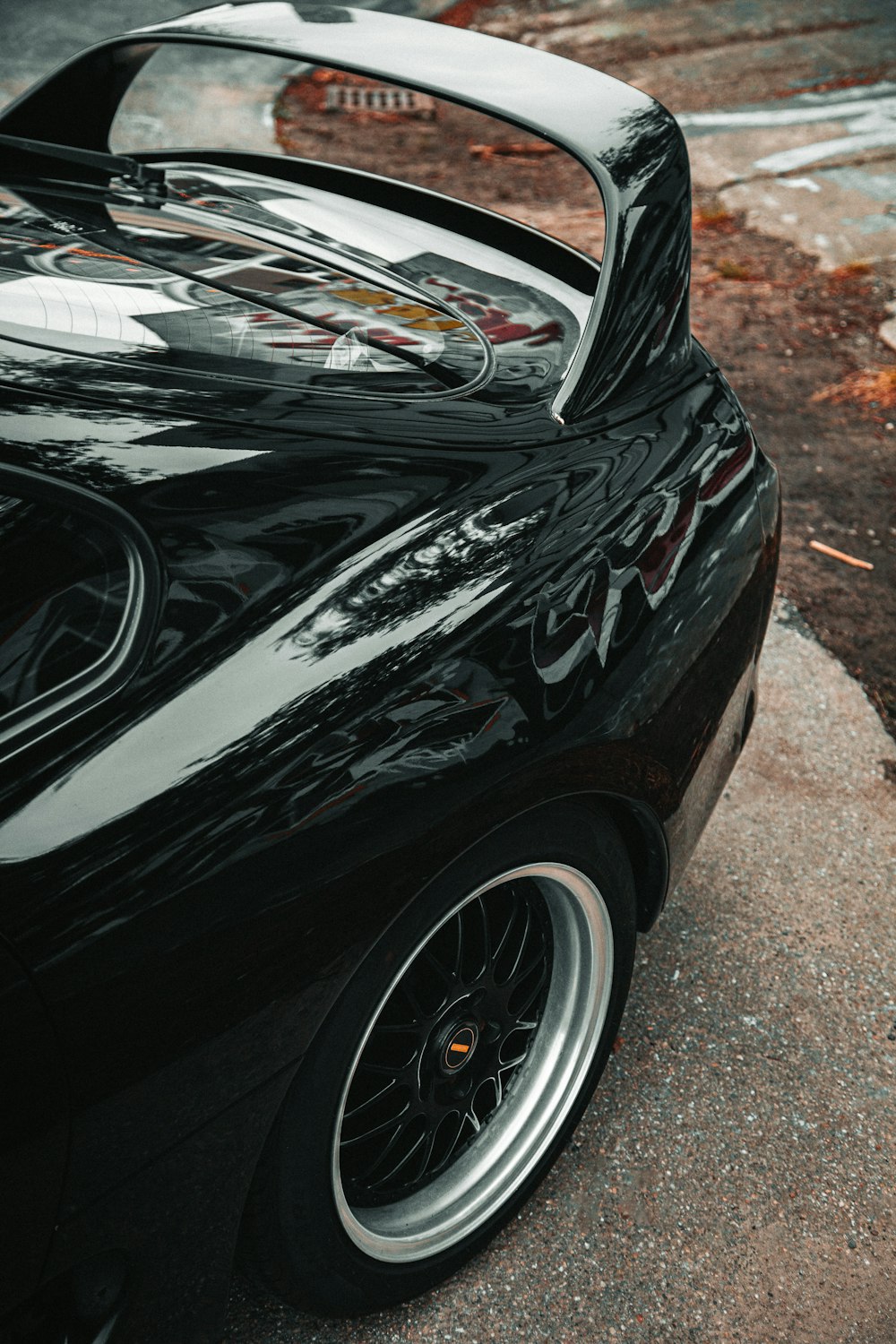 a black sports car parked on the side of the road