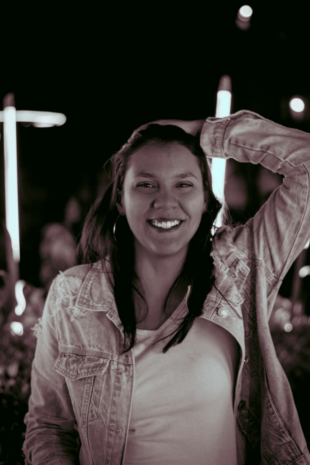 a woman is posing for a picture in a black and white photo