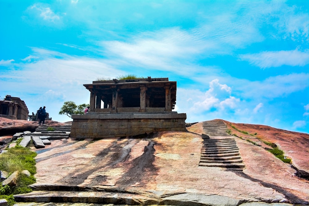 a stone structure with steps leading up to it