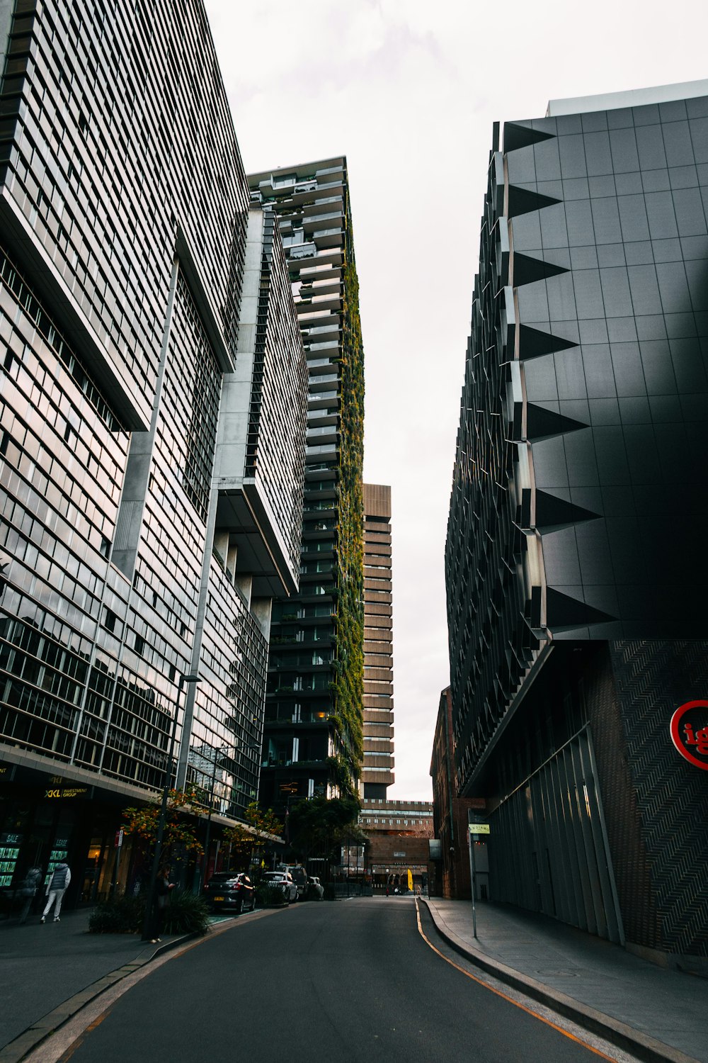 a city street lined with tall buildings next to each other