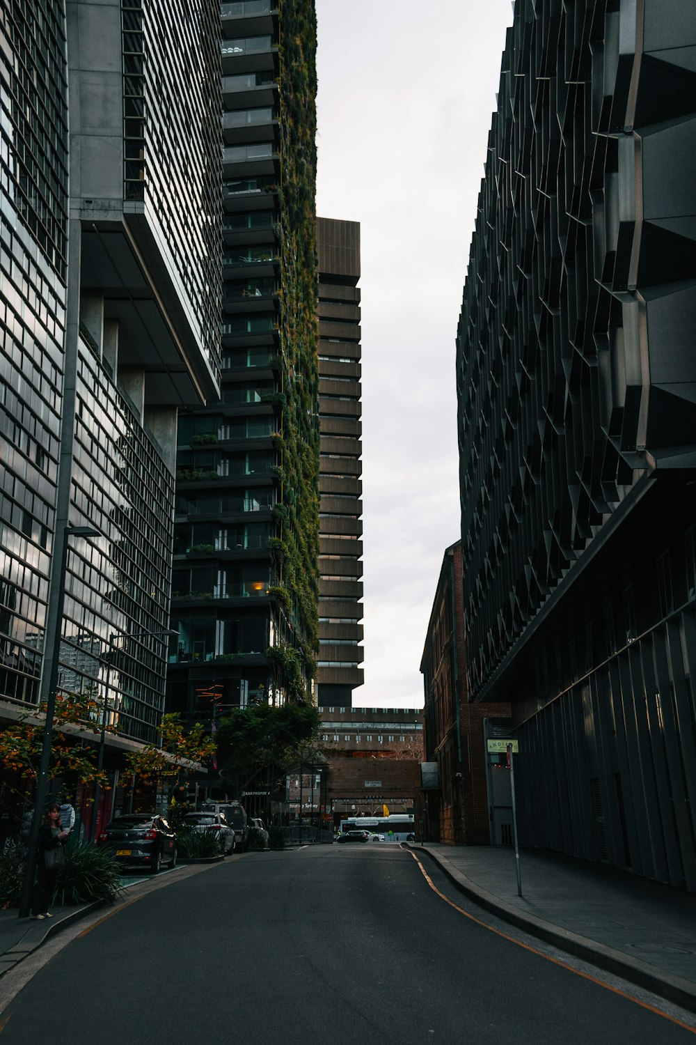 a city street with tall buildings next to each other