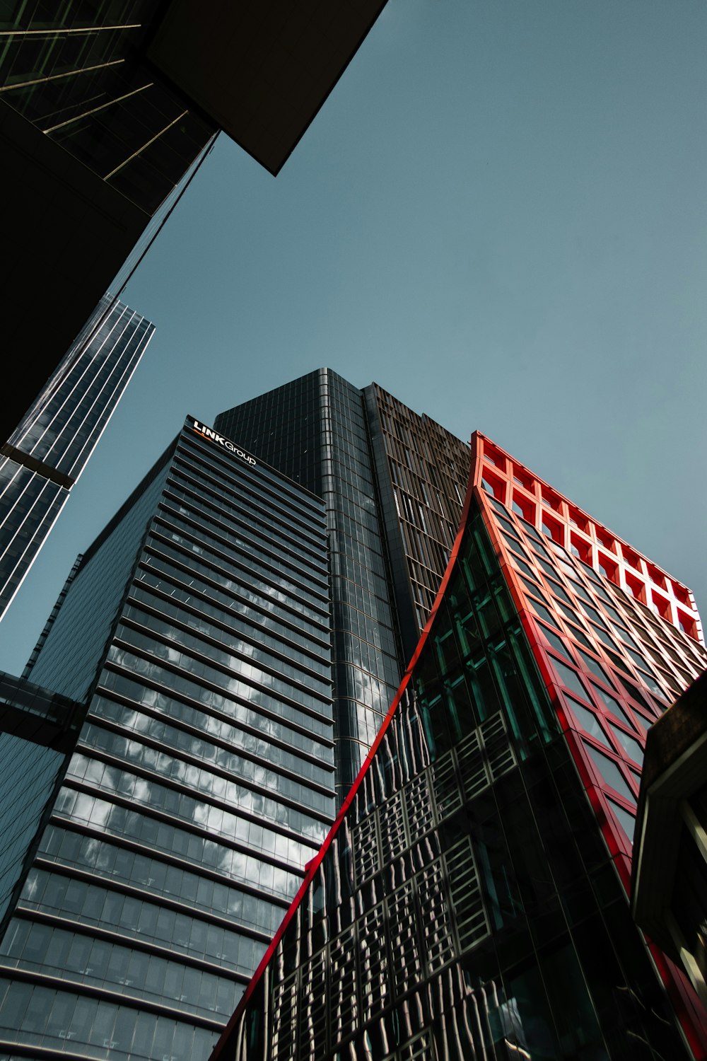 a very tall building with a red roof