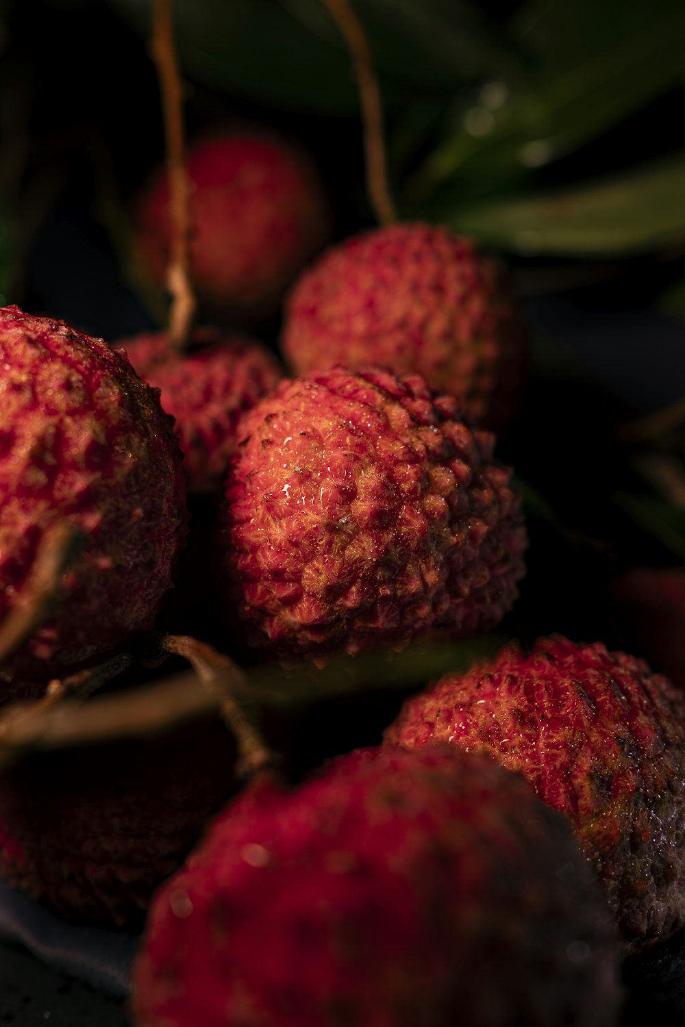 a pile of red fruit sitting on top of a table