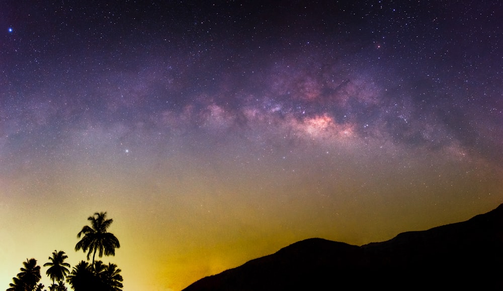 a view of the night sky with the milky in the background