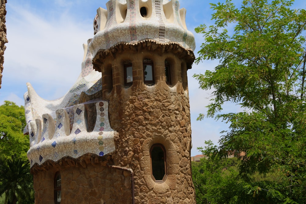 a very tall tower with a clock on it's side