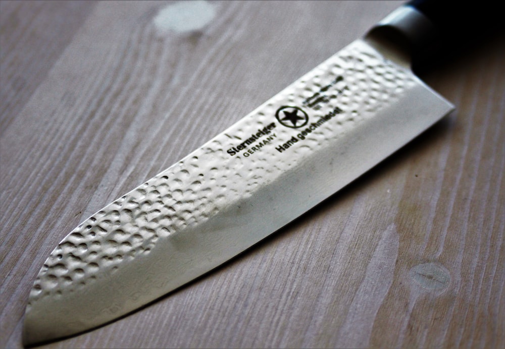 a close up of a knife on a table