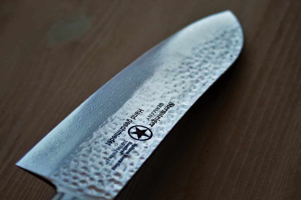 a close up of a knife on a table