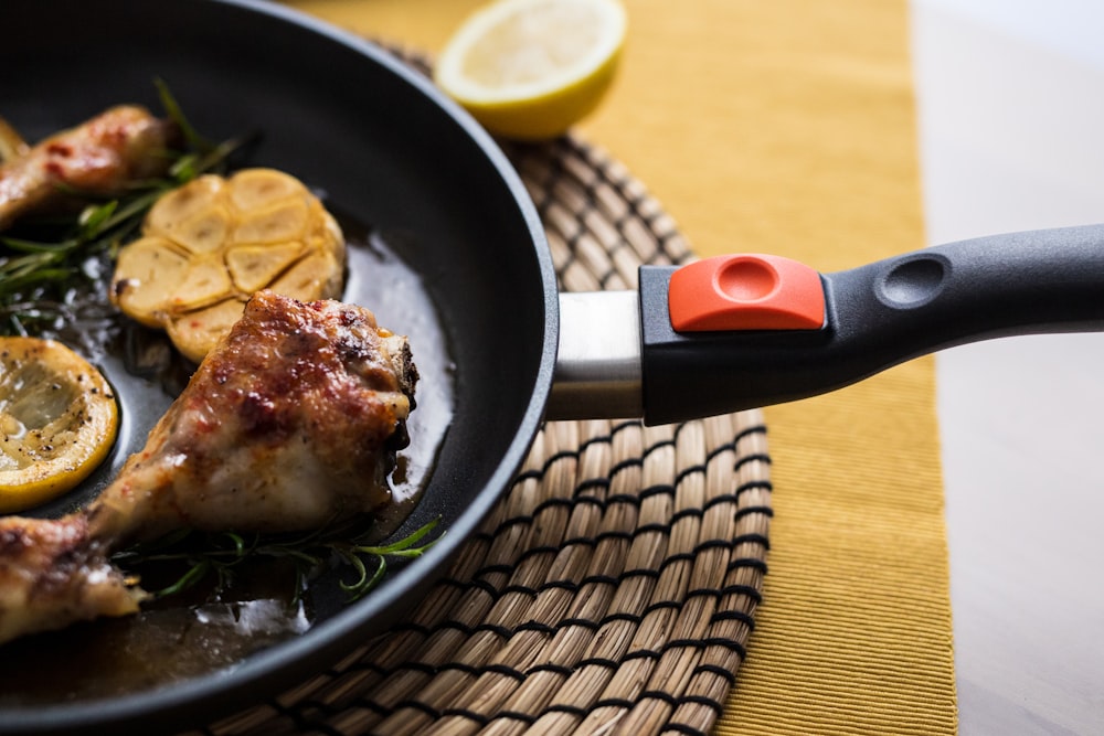 a close up of a frying pan with food on it