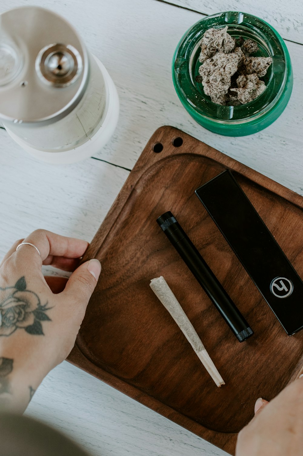 a person cutting up food on a cutting board