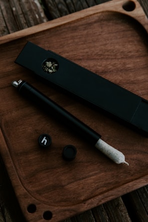 An array of colorful smoking accessories arranged artistically.