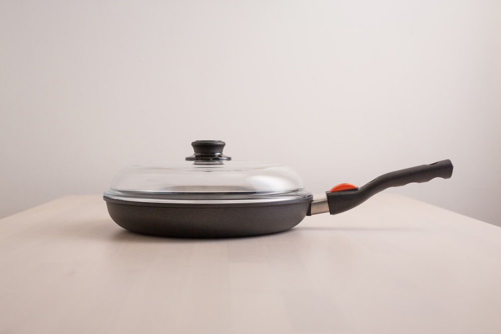 a pan with a lid on a table