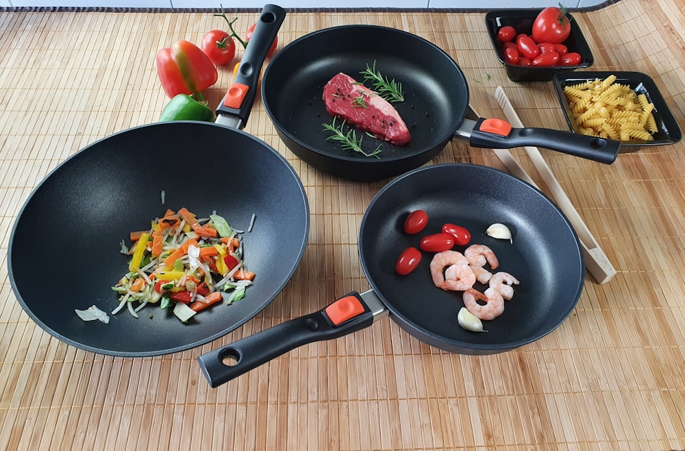 a couple of pans that have some food in them