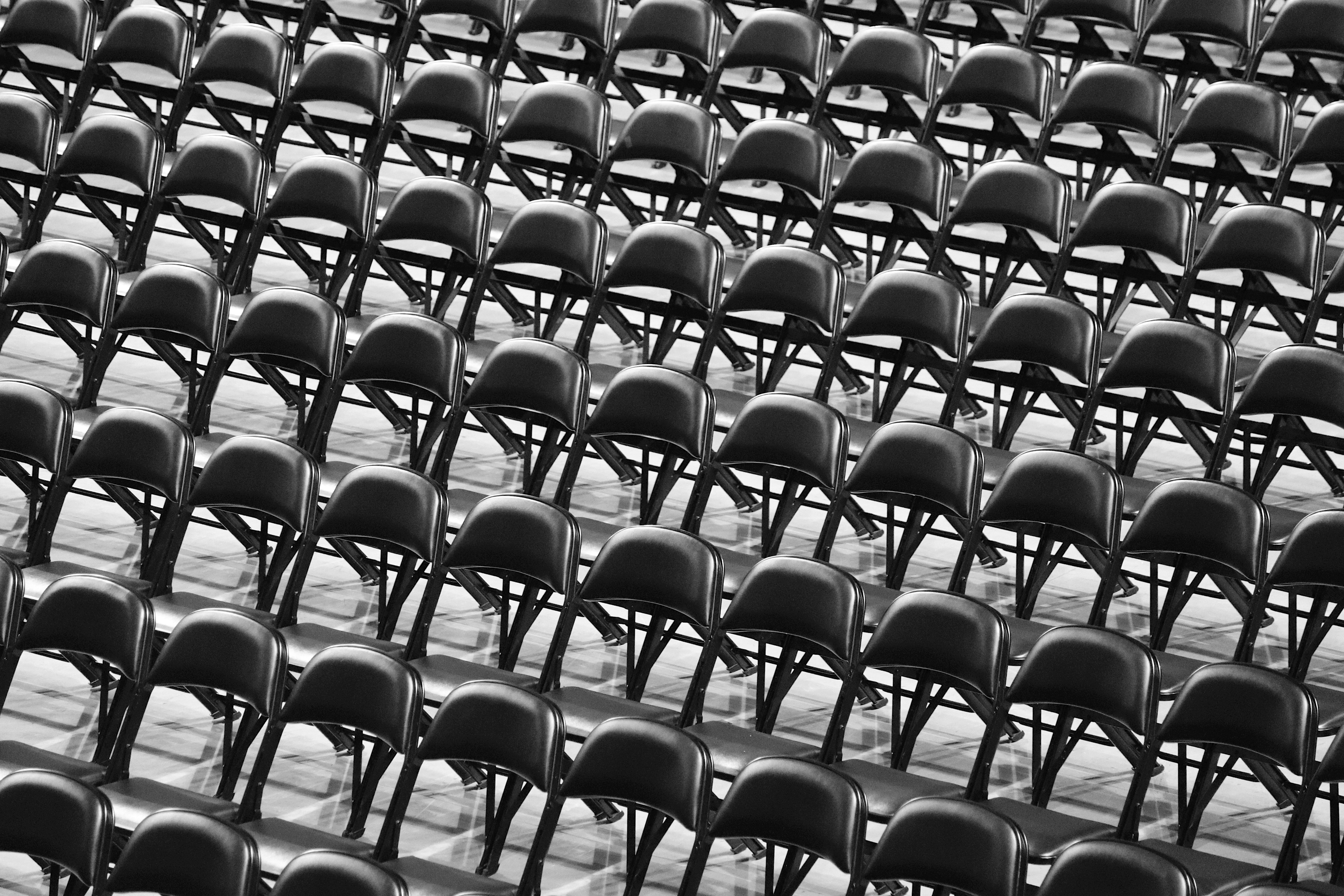 black and white photograph of rows of chairs