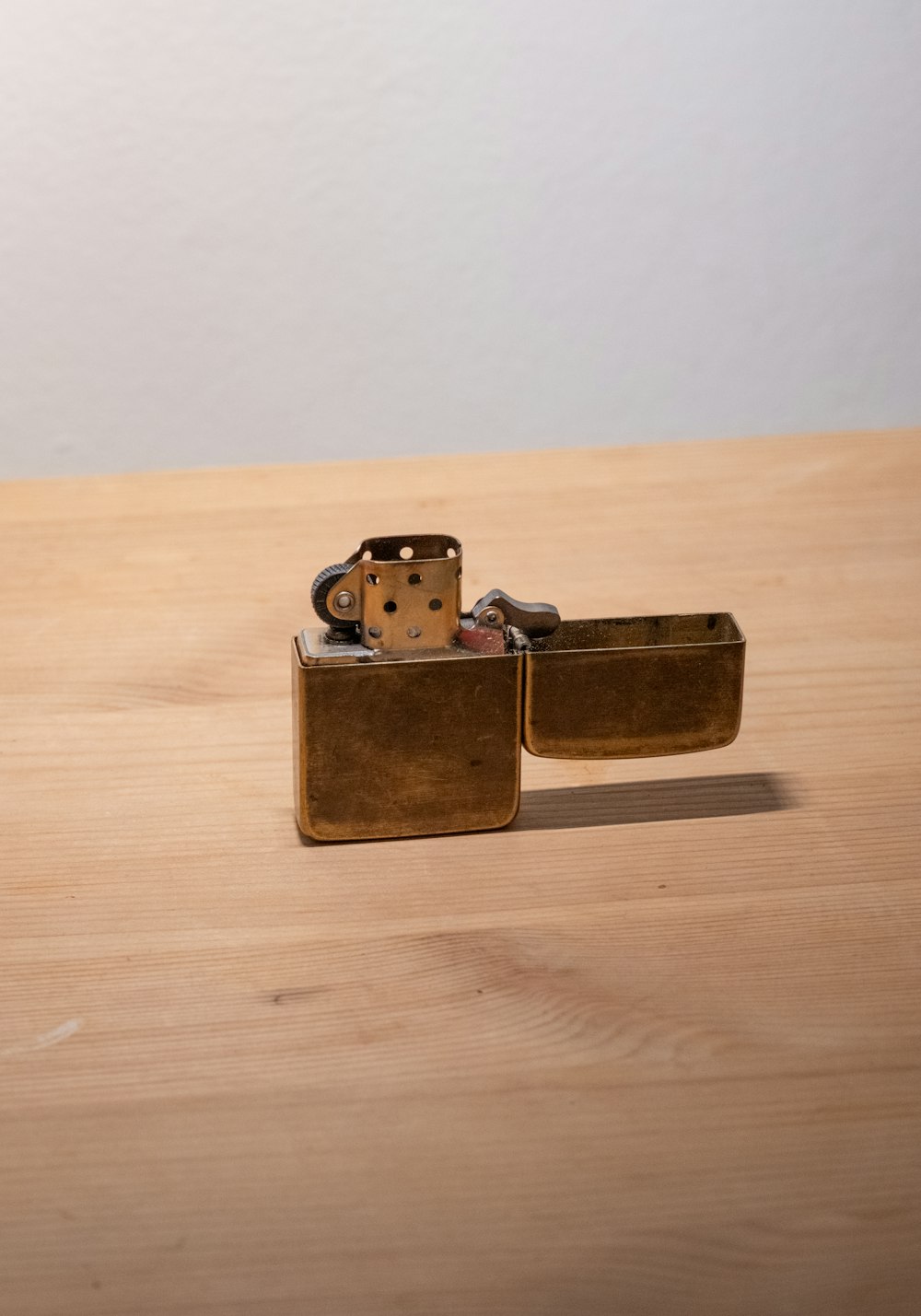 a couple of lighters sitting on top of a wooden table