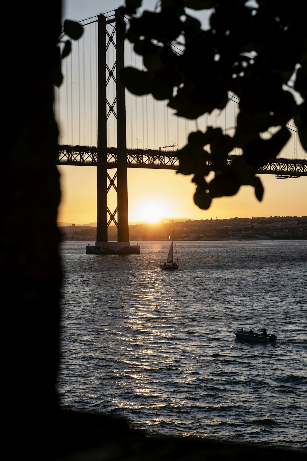 a boat is in the water near a bridge