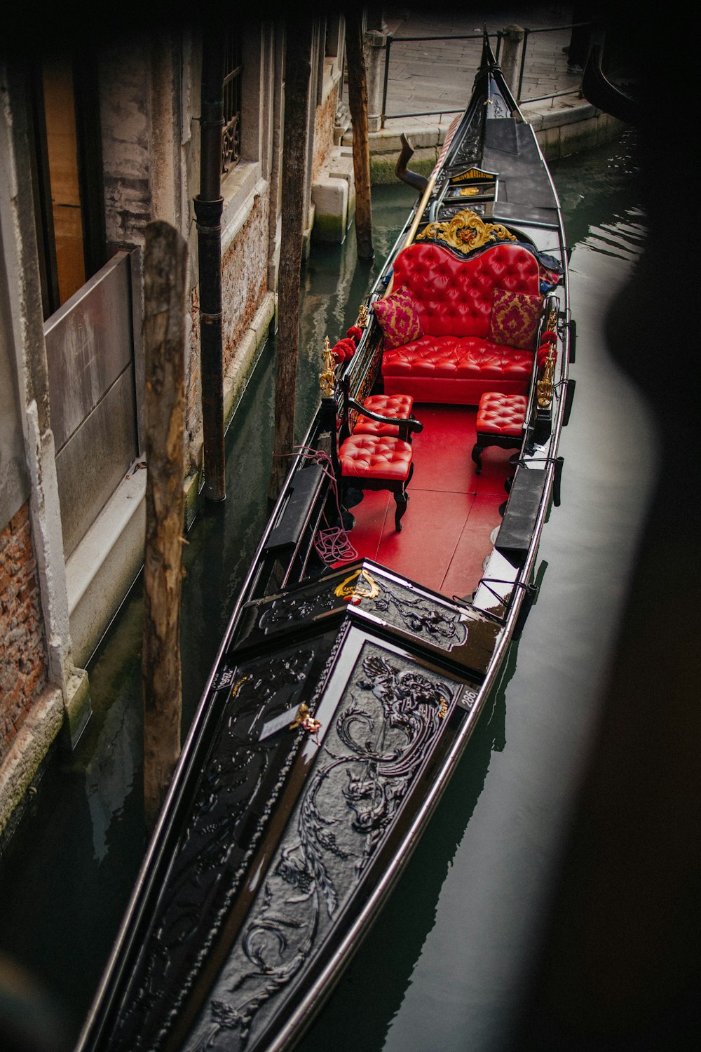 a gondola with a red seat on the side of it