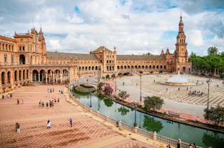 a large building with a fountain in front of it