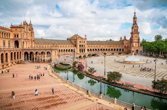 a large building with a fountain in front of it