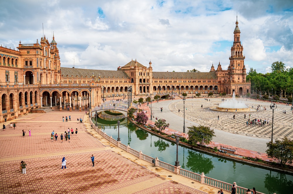 a large building with a fountain in front of it