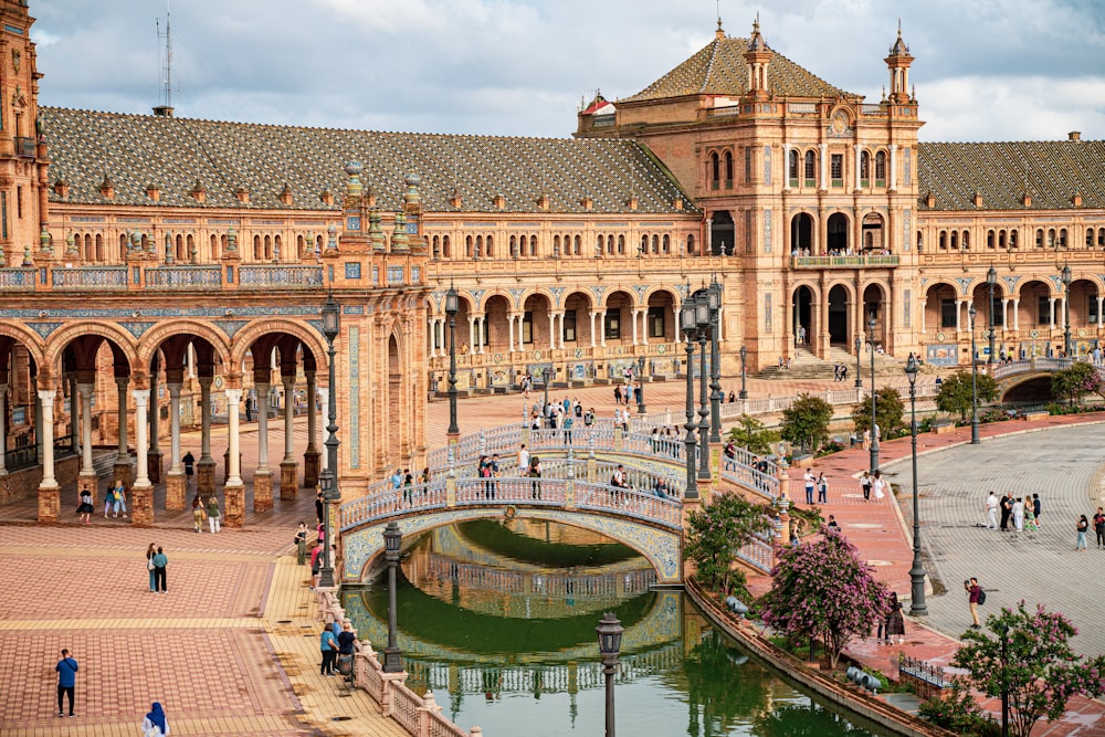 a large building with a bridge in front of it