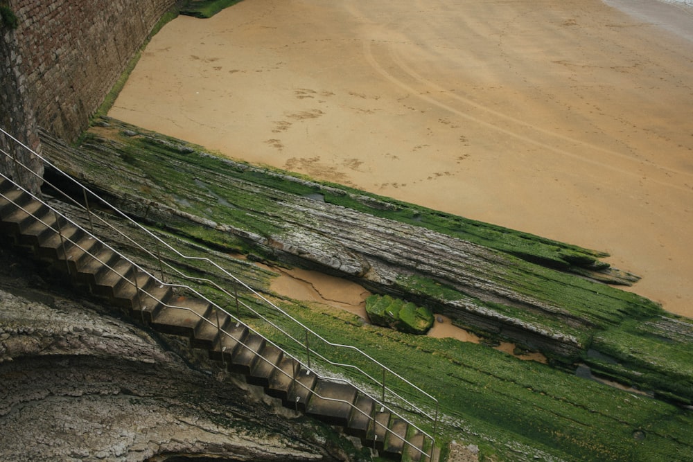 a set of stairs leading down to a beach