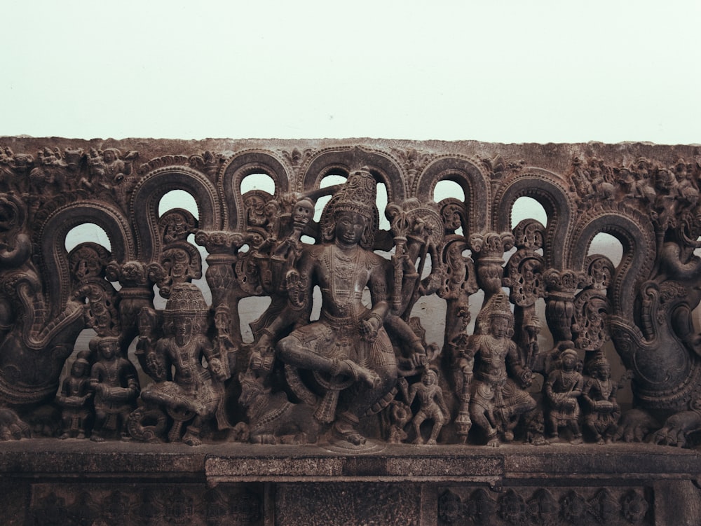 a sculpture of a group of people and animals