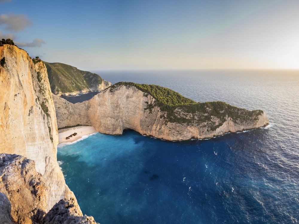 an aerial view of a beach and a cliff