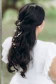a woman with a flower in her hair