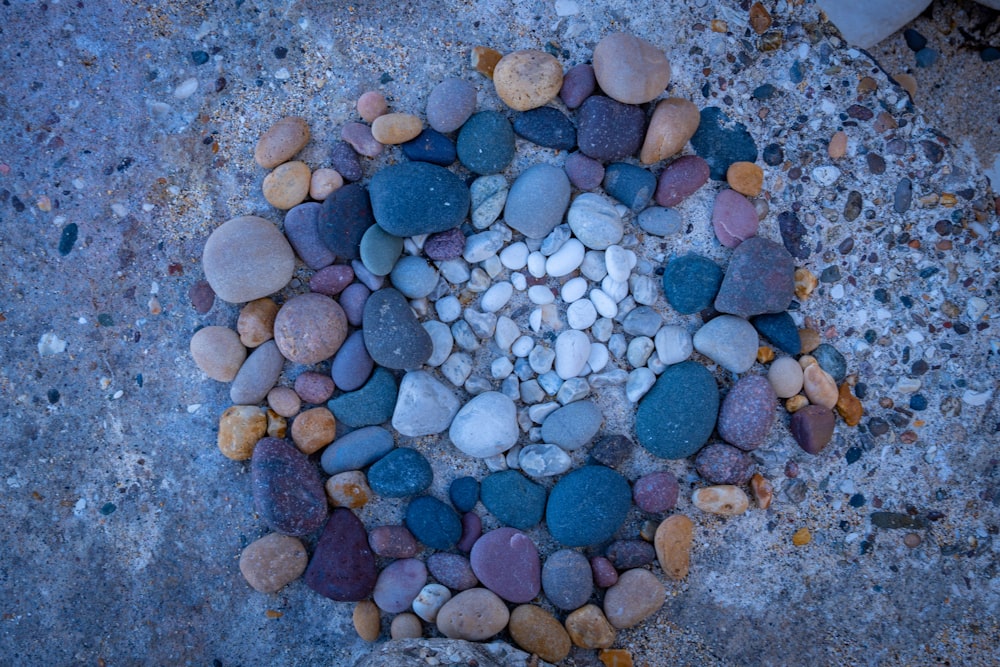 a circle of rocks on a concrete surface