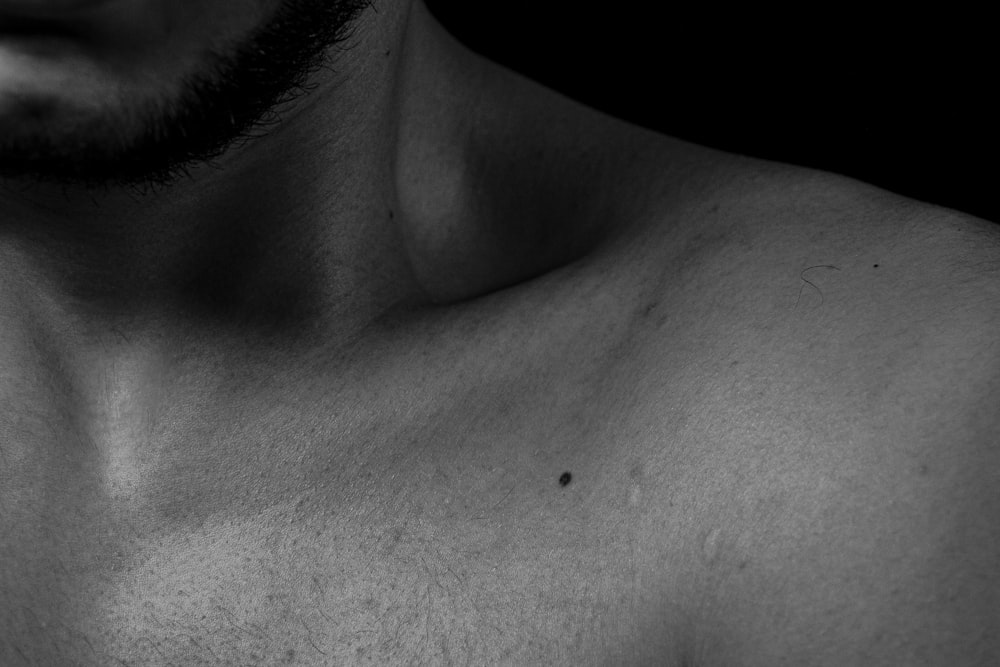 a close up of a shirtless man's chest