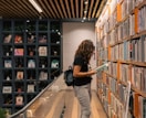 a woman reading a book in a library