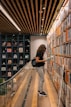 a woman reading a book in a library