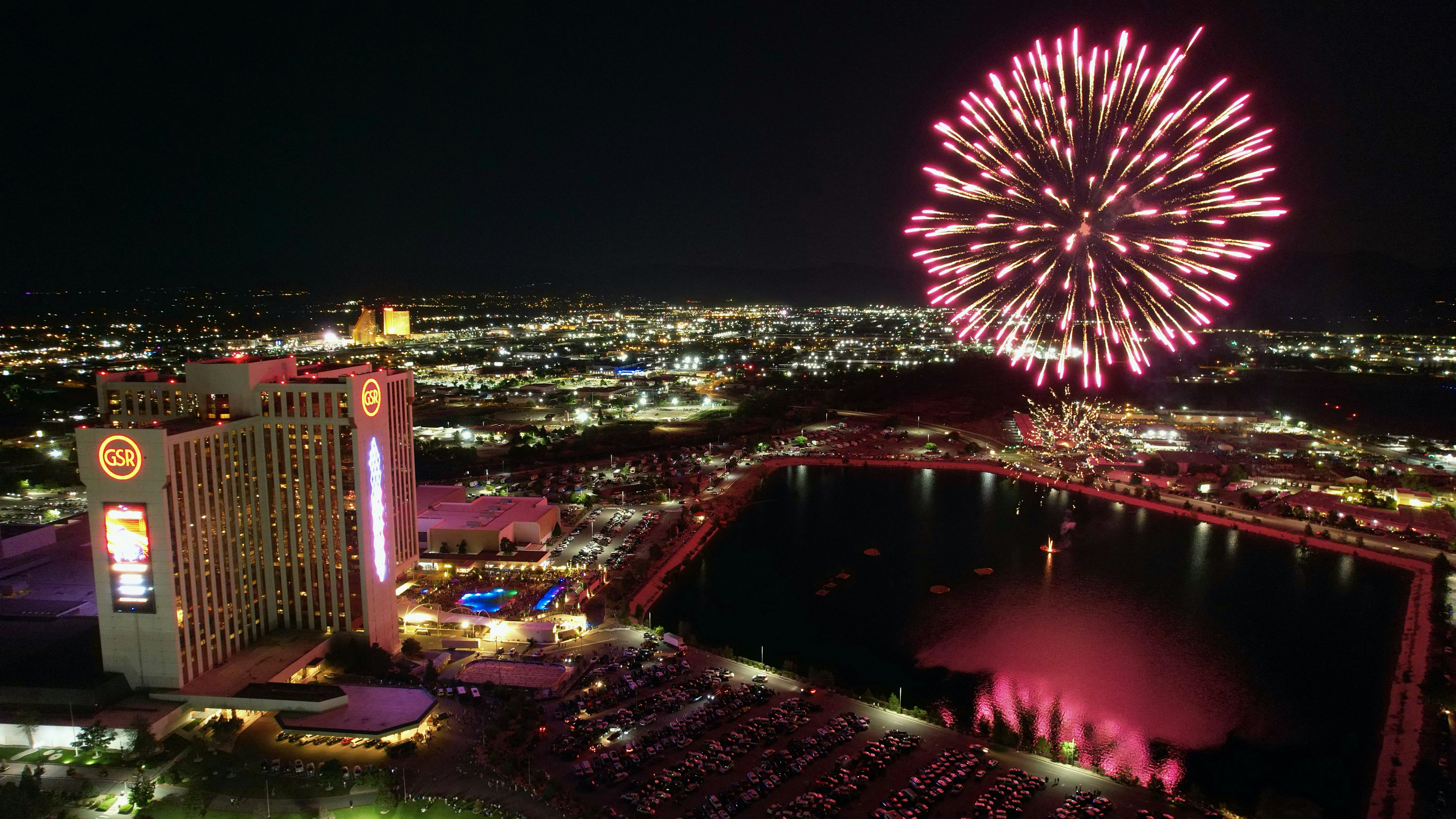 a fireworks display over a city at night