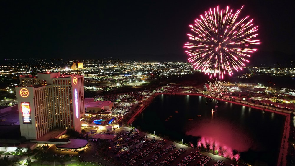 a fireworks display over a city at night